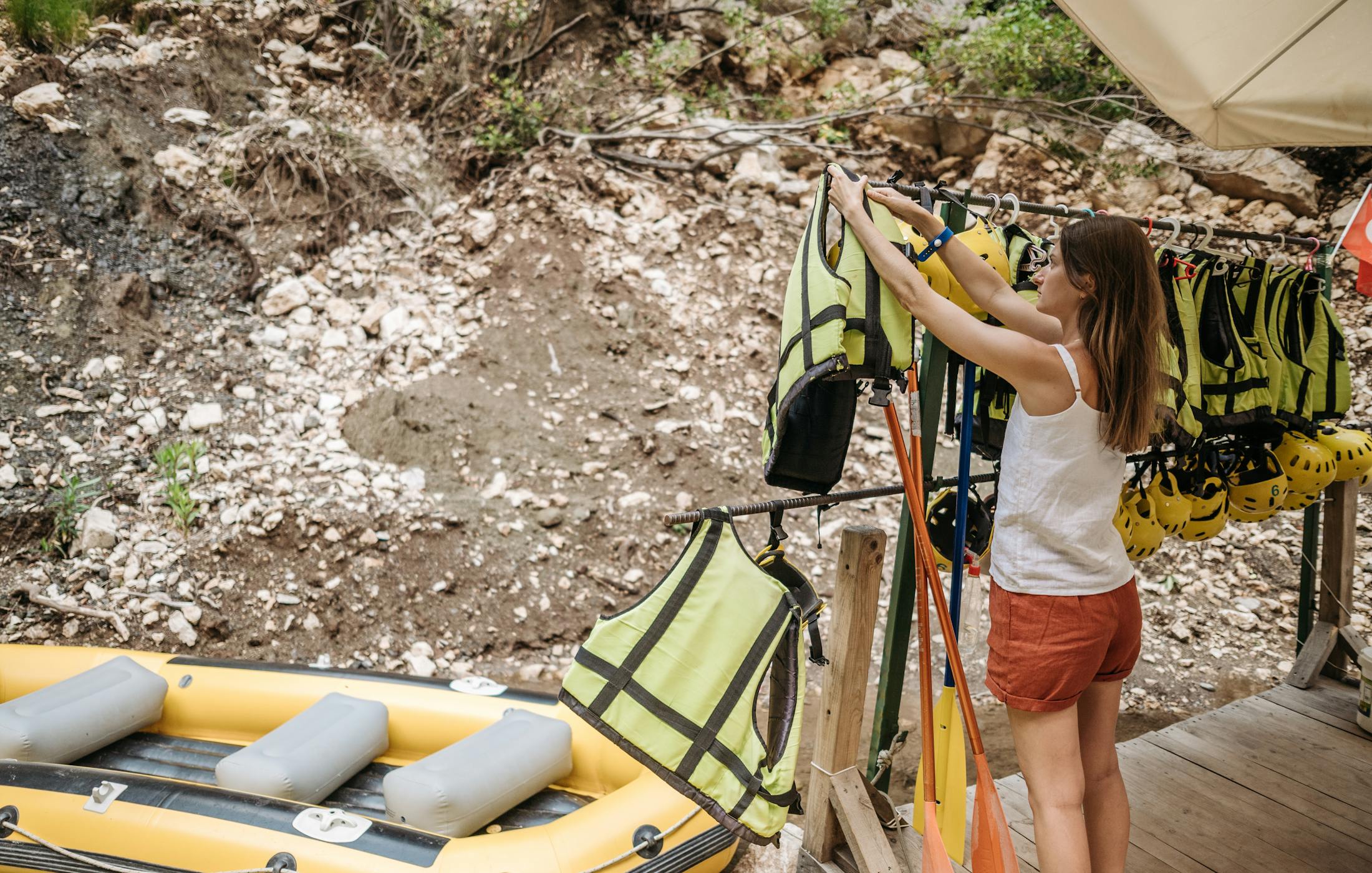 Participant preparing safety gear before a kayak activity